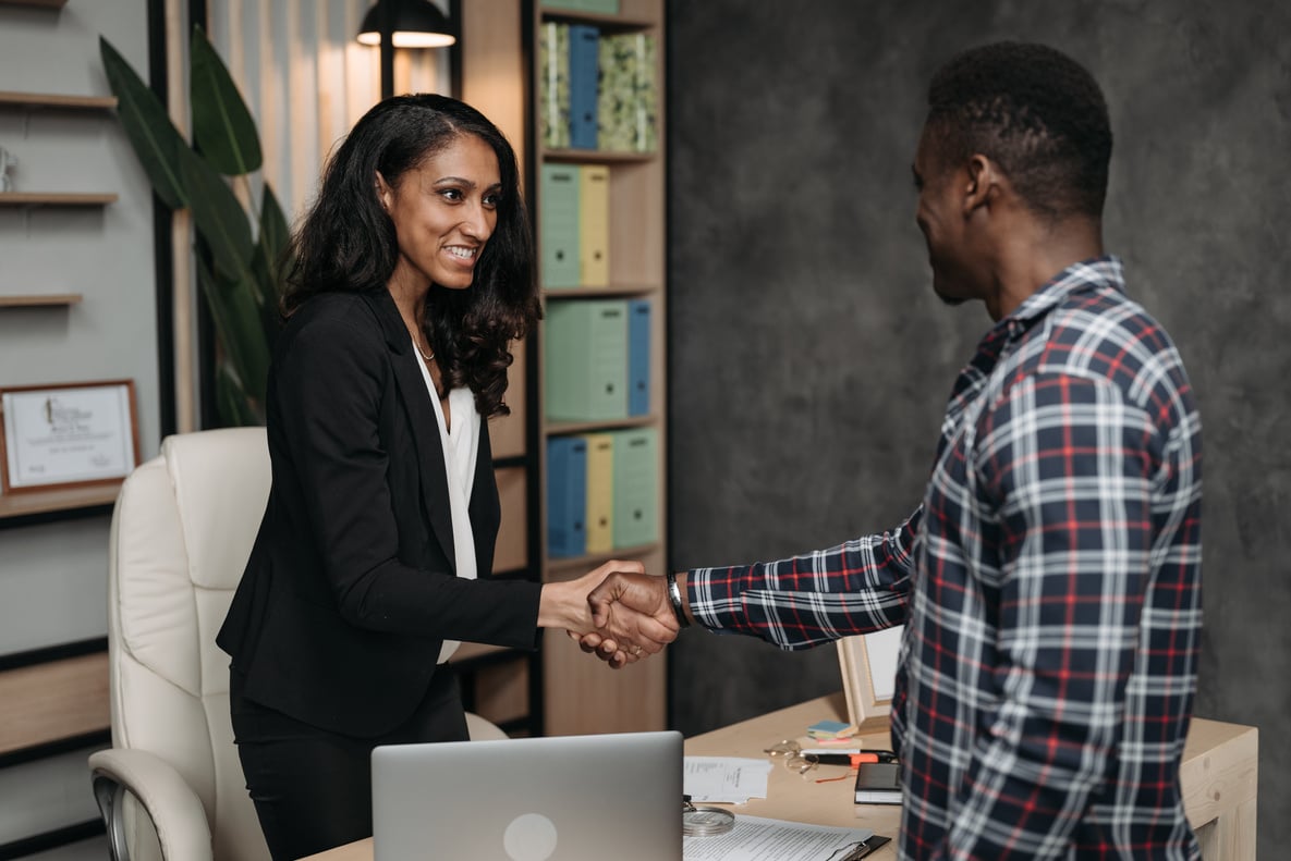 Female Lawyer and Client doing a Handshake