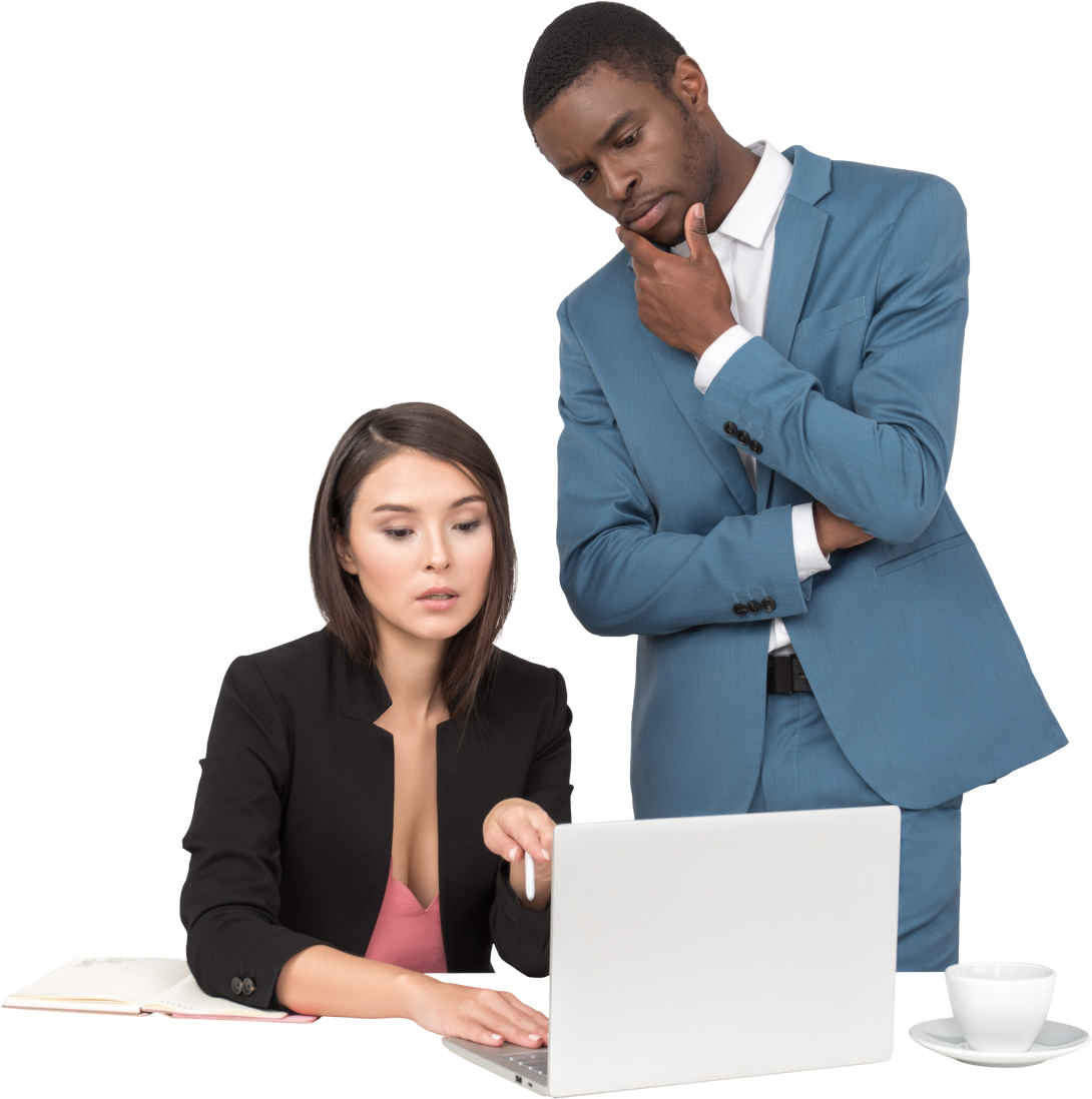 Man and Woman in Business Attire Looking at Laptop